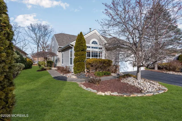 a view of living room filled with furniture and a window