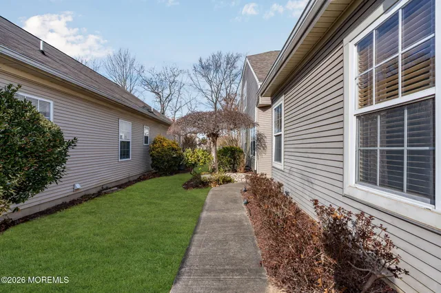 a living room with furniture and a kitchen view
