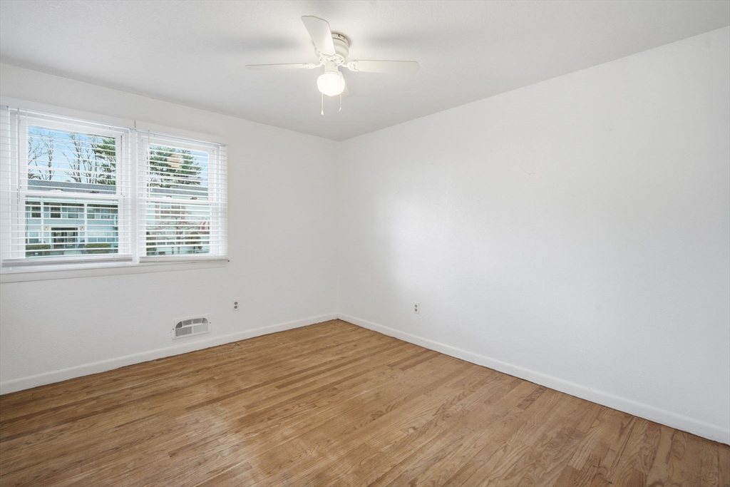 181 Beauchamp Terrace Chicopee, MA 01020 - Photo 19 of 36 wooden floor in an empty room with a window