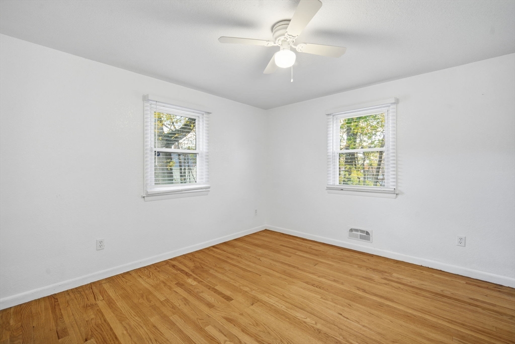 181 Beauchamp Terrace Chicopee, MA 01020 - Photo 21 of 36 a view of empty room with wooden floor and fan