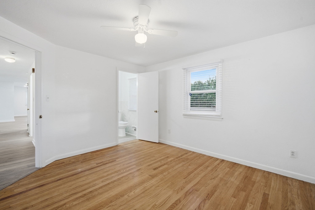 181 Beauchamp Terrace Chicopee, MA 01020 - Photo 22 of 36 wooden floor in an empty room with a window