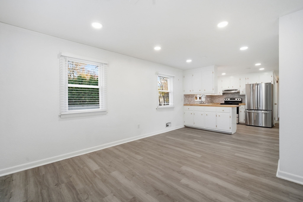 181 Beauchamp Terrace Chicopee, MA 01020 - Photo 8 of 36 a view of a kitchen with a sink wooden cabinets and stainless steel appliances