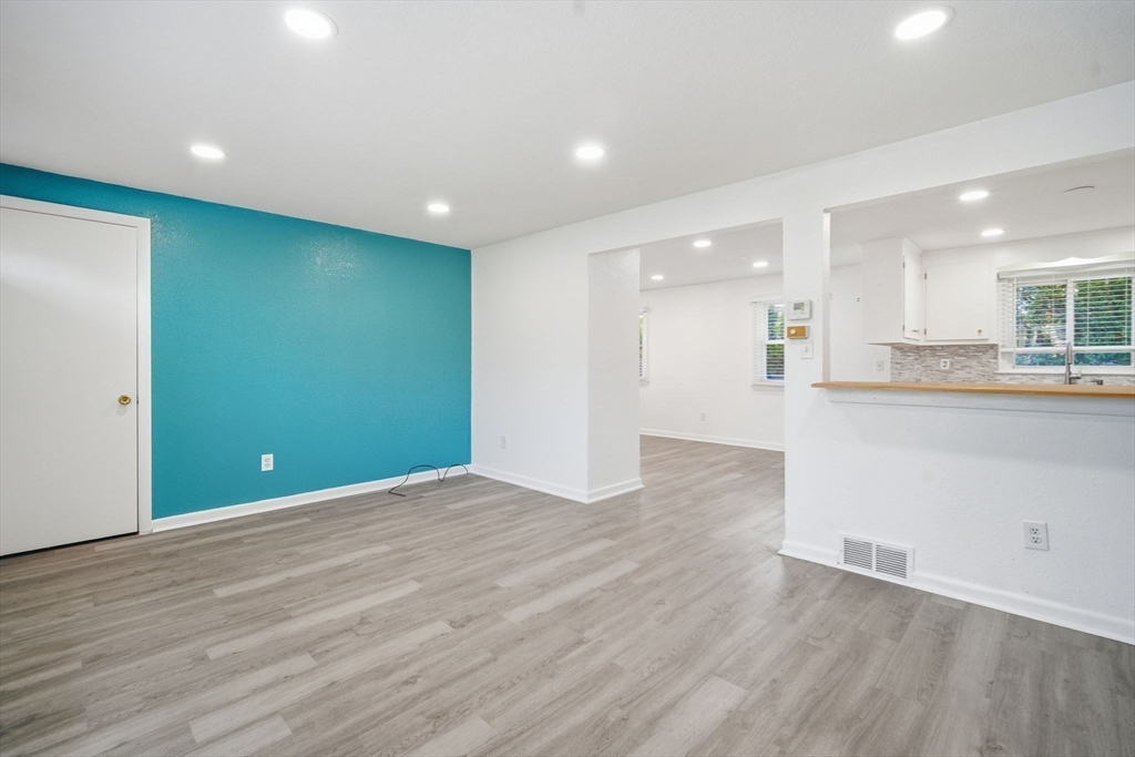 181 Beauchamp Terrace Chicopee, MA 01020 - Photo 10 of 36 an empty room with wooden floor and windows