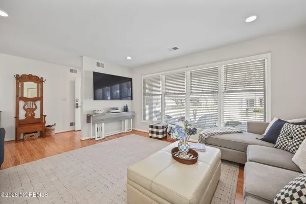 a view of a livingroom with furniture and wooden floor