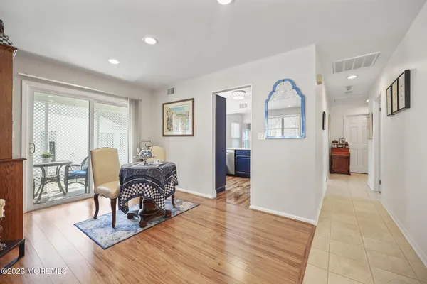 a bedroom with furniture and wooden floor
