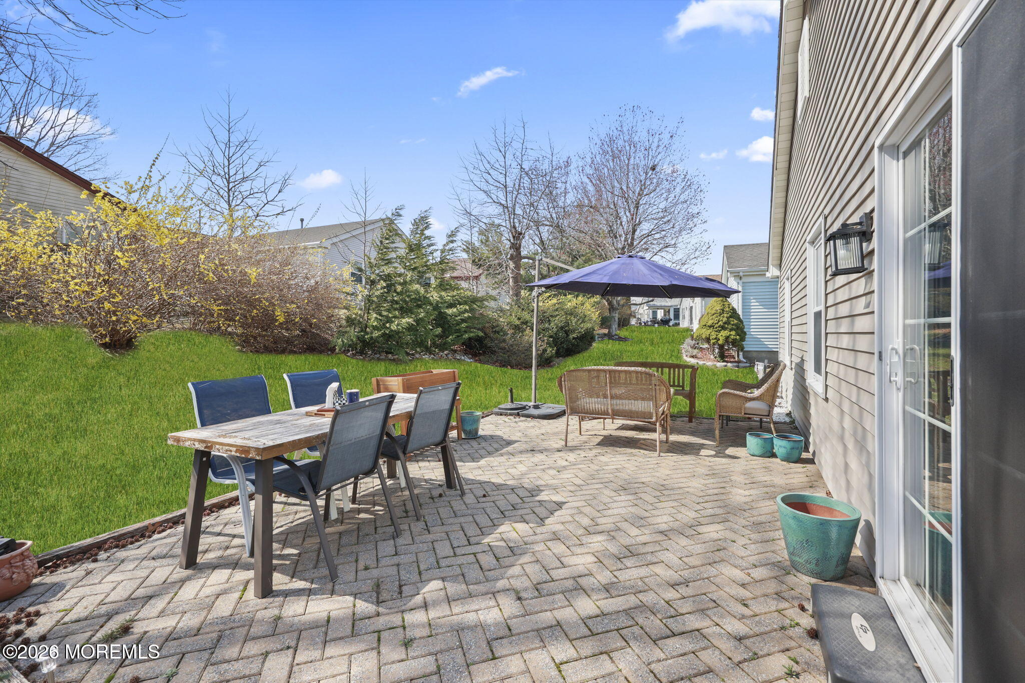 2254 Beltane Road Toms River, NJ 08755 - Photo 37 of 44 a view of a patio with a table and chairs under an umbrella