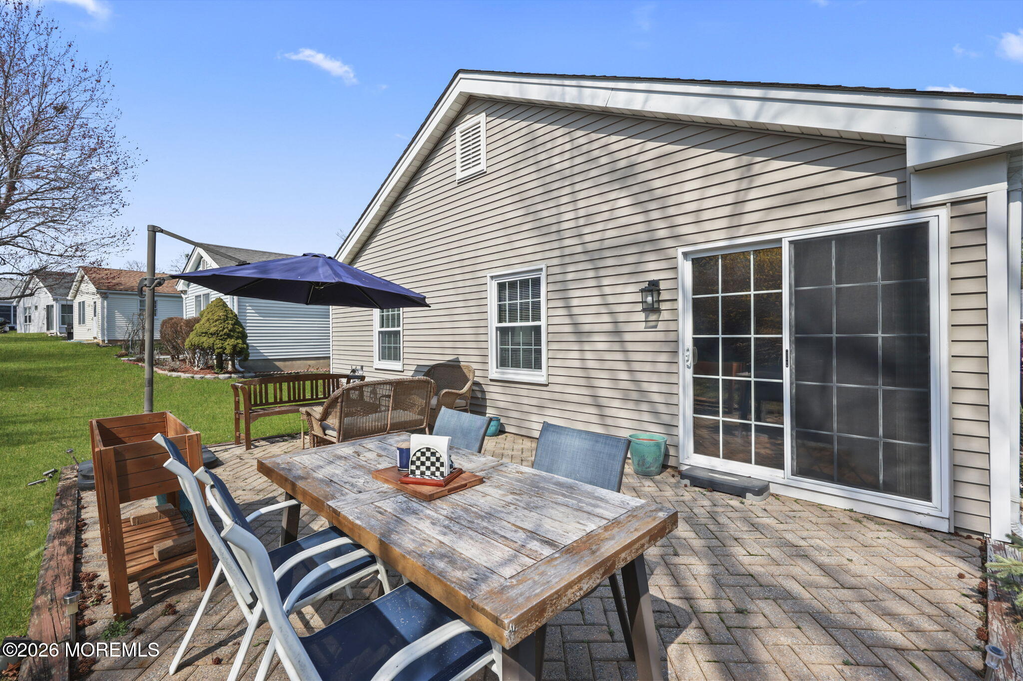 2254 Beltane Road Toms River, NJ 08755 - Photo 38 of 44 a view of a patio with table and chairs and potted plants