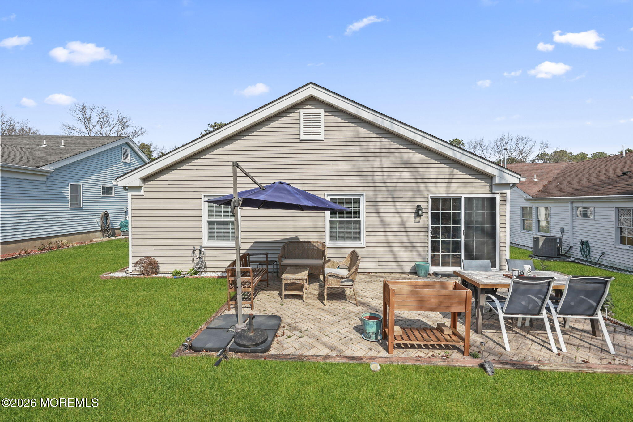 2254 Beltane Road Toms River, NJ 08755 - Photo 39 of 44 a view of a house with a yard and chairs