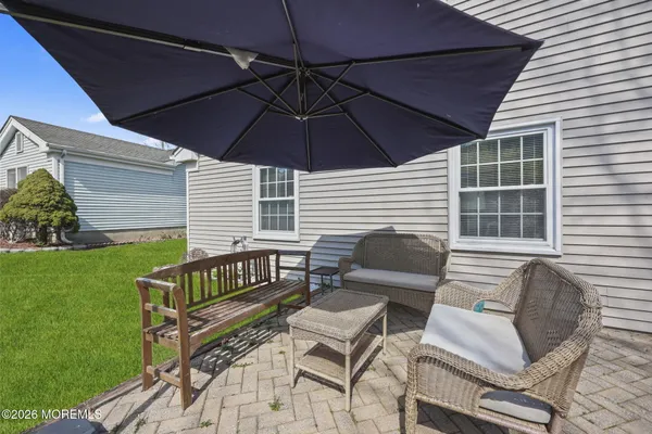 a backyard of a house with outdoor seating
