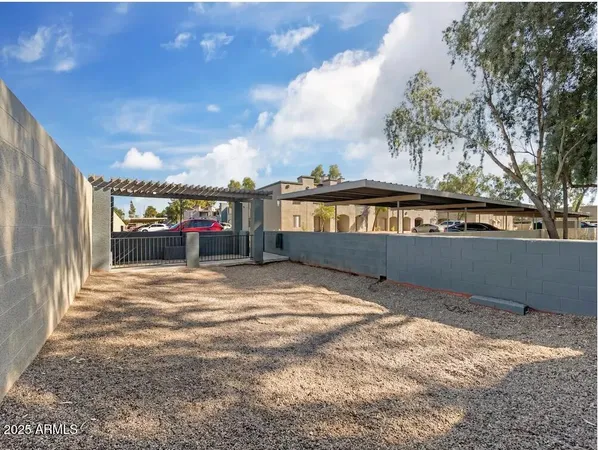 a view of swimming pool with an outdoor seating