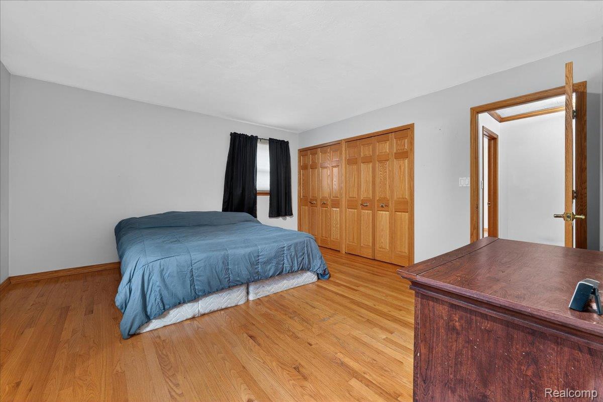 4049 Slattery Road North Branch, MI 48461 - Photo 30 of 45 Bedroom with light wood-type flooring and a closet