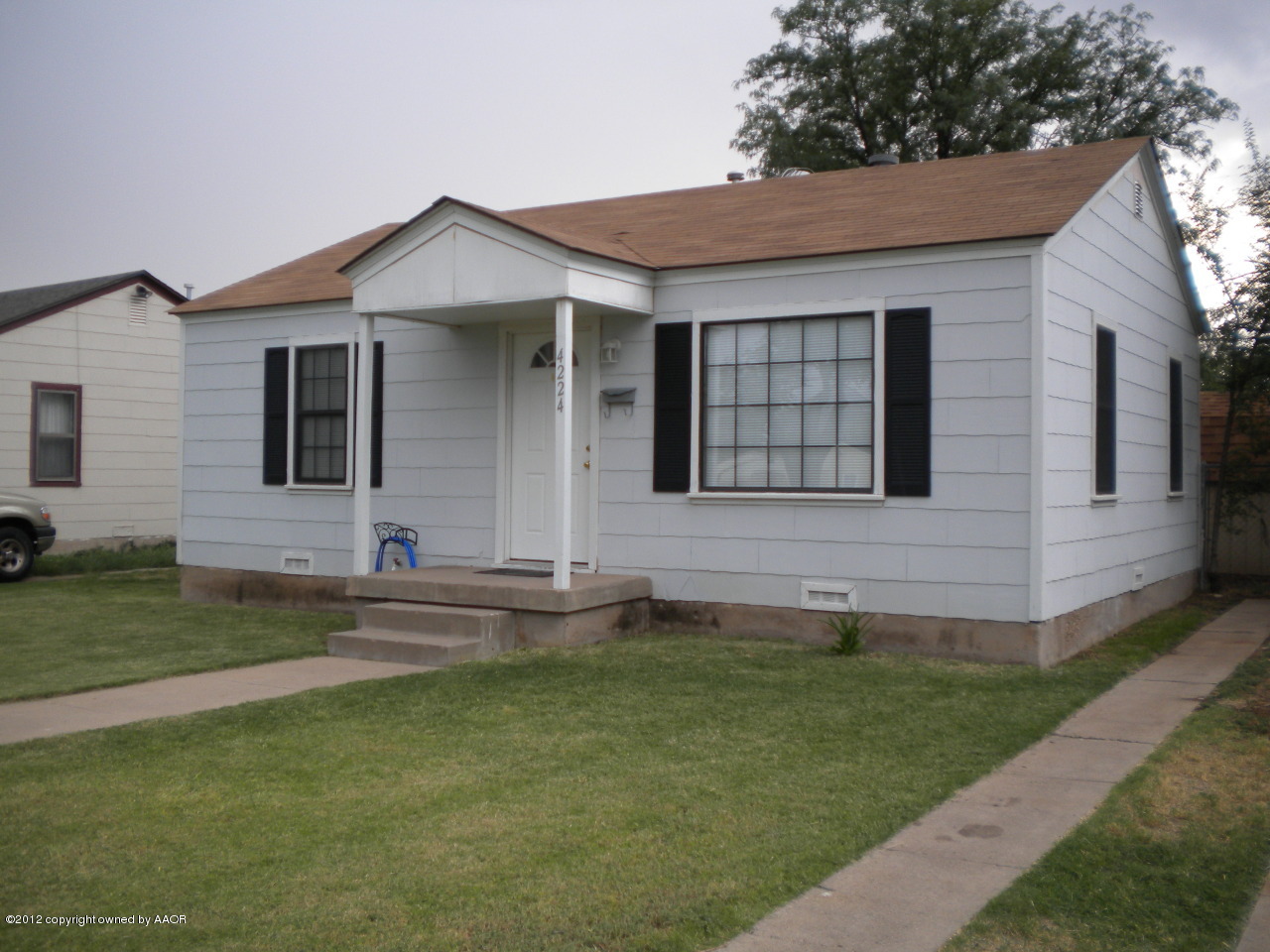 4224 South Harrison Street Amarillo, TX 79110 - Photo 2 of 15 a front view of a house with a yard