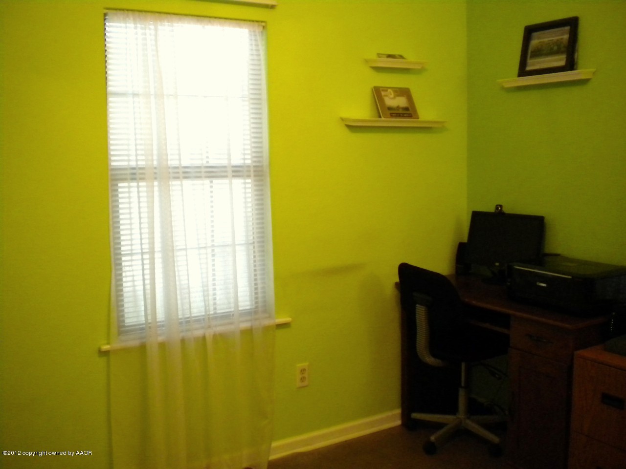 4224 South Harrison Street Amarillo, TX 79110 - Photo 13 of 15 a view of a window and chair