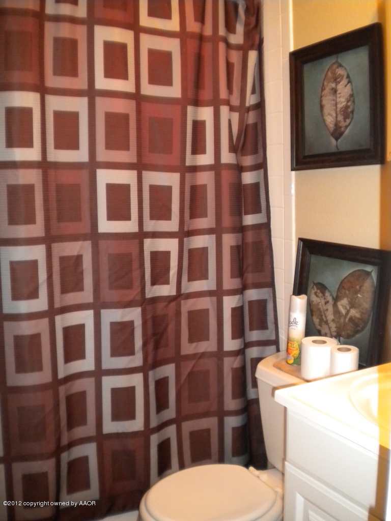 4224 South Harrison Street Amarillo, TX 79110 - Photo 15 of 15 a bathroom with a toilet and a sink