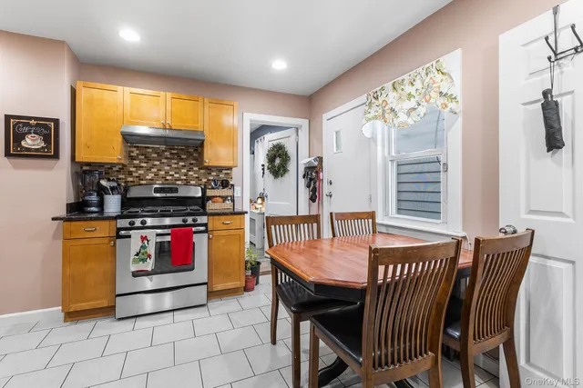 a dining room with furniture and window