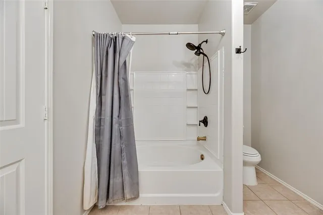 a bathroom with a shower and a bath tub