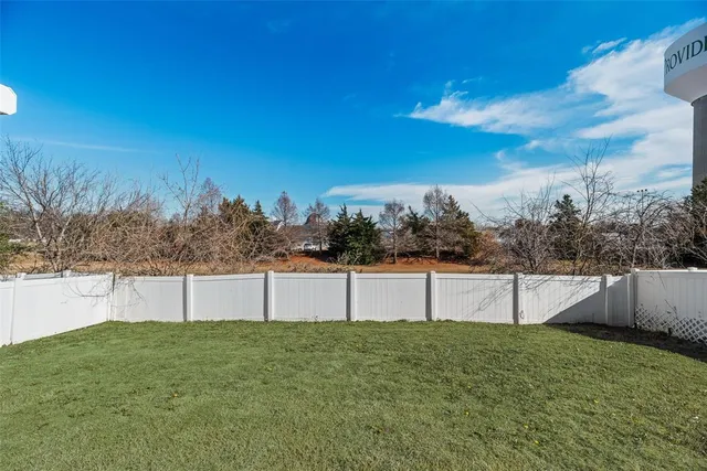 a view of backyard with trampoline