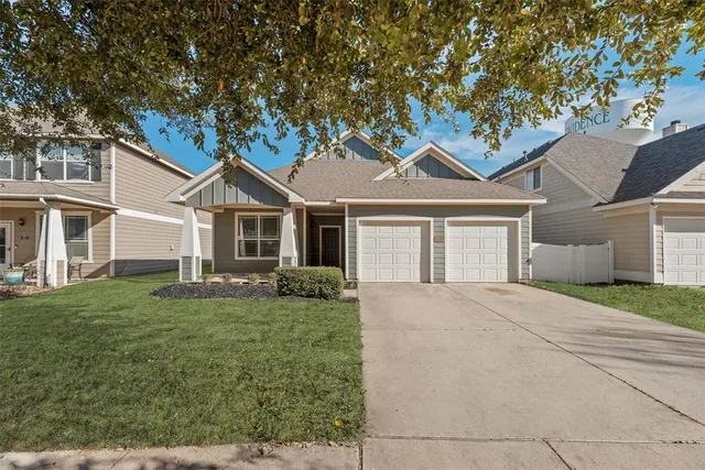 a front view of a house with a garden and porch