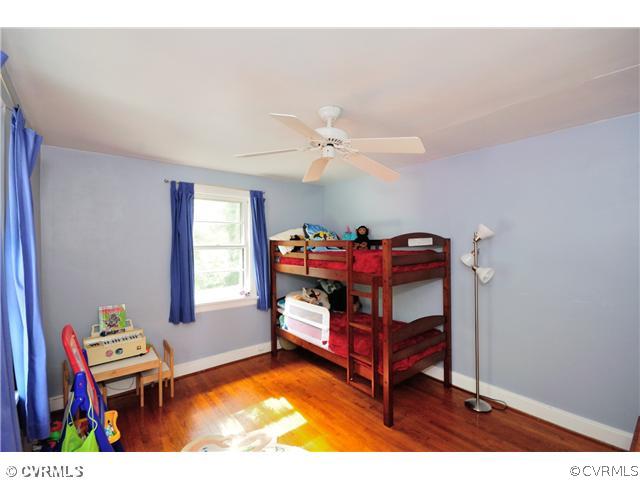 8302 Cherokee Road Richmond, VA 23235 - Photo 16 of 24 Bedroom - This bedroom has hardwood floor, a close