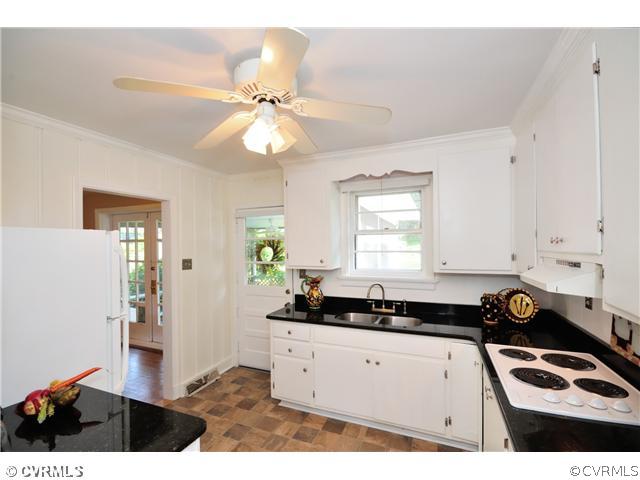 8302 Cherokee Road Richmond, VA 23235 - Photo 10 of 24 Kitchen - This view of the kitchen shows a door ac