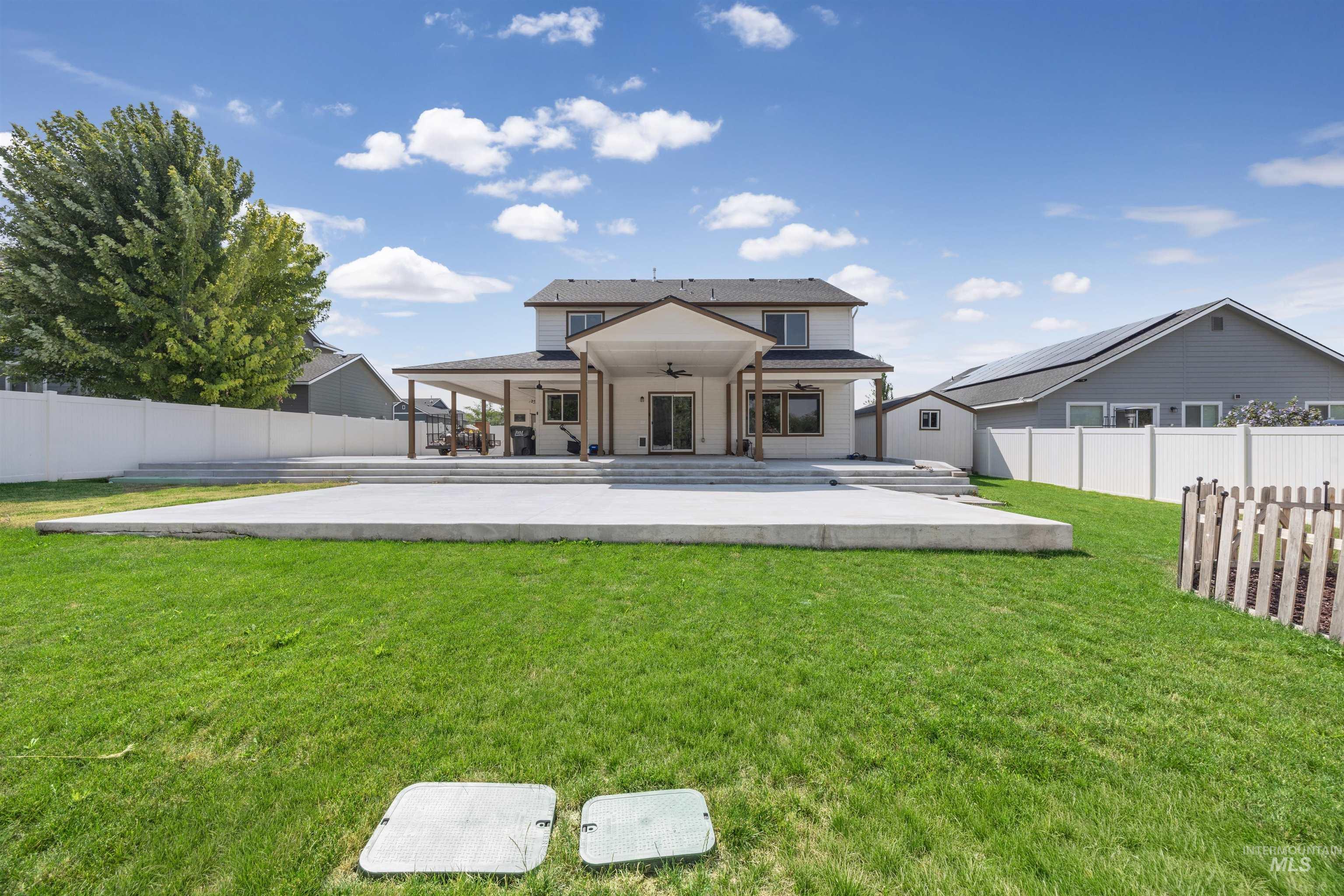300 South Rocker Avenue Kuna, ID 83634 - Photo 41 of 49 Expansive backyard featuring a manicured lawn and multi-level concrete patio