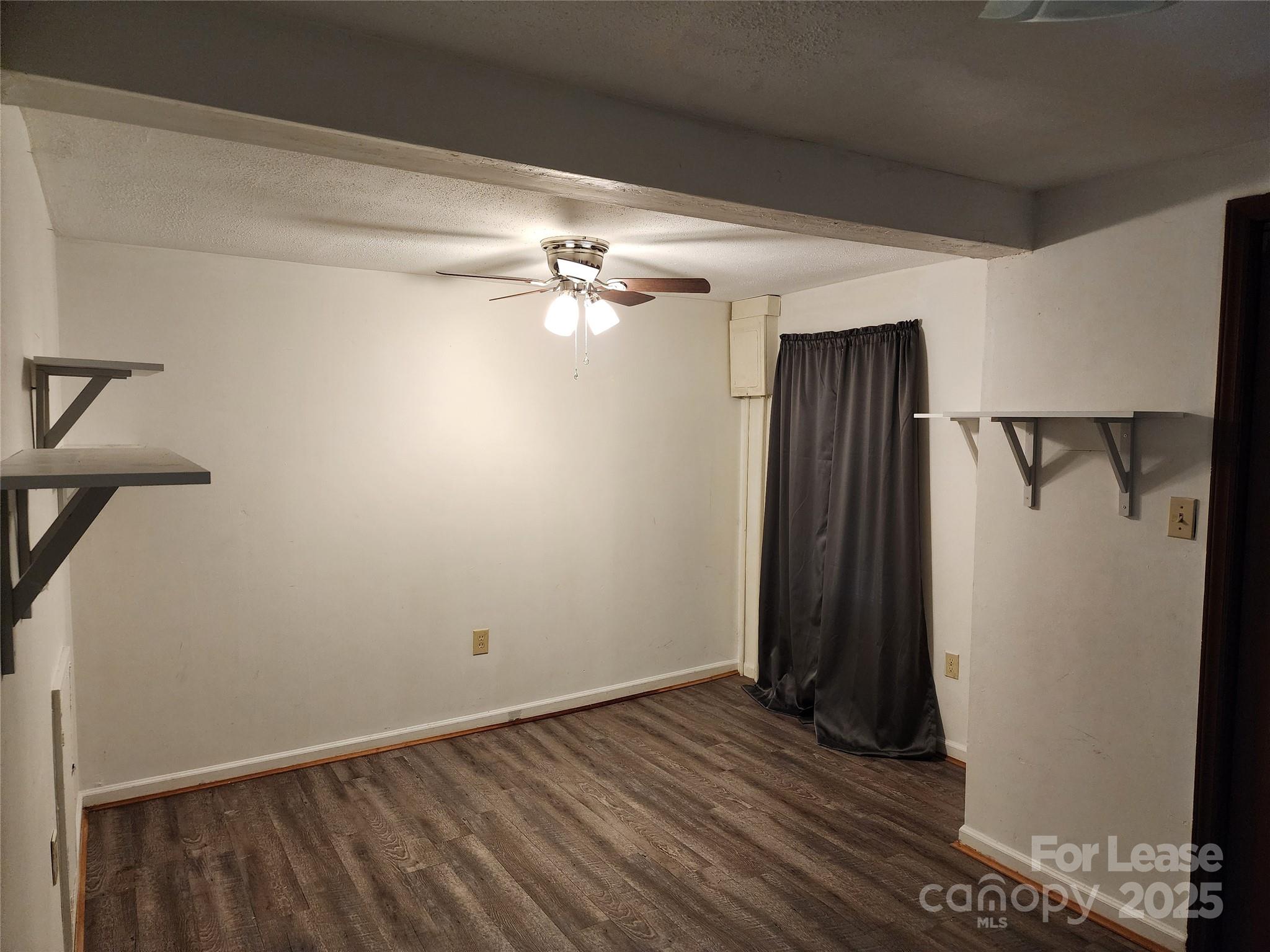 435 Rankin Street Northwest Lenoir, NC 28645 - Photo 5 of 10 a view of a room with wooden floor