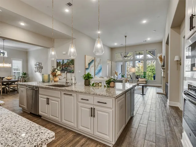 a kitchen with lots of counter space and wooden floor