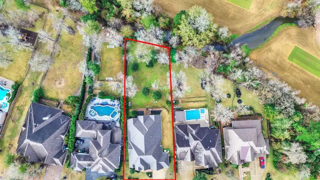 an aerial view of a houses with outdoor space