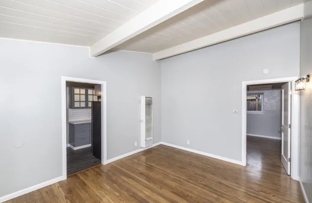 a kitchen with a refrigerator and a sink