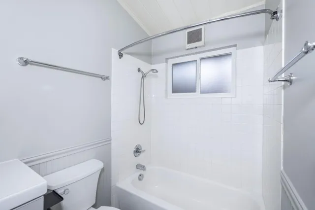a bathroom with a sink a mirror and a bathtub