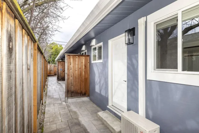 a view of a house with a garage and a sink