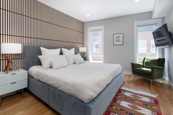 a bed room with a bed and a couch