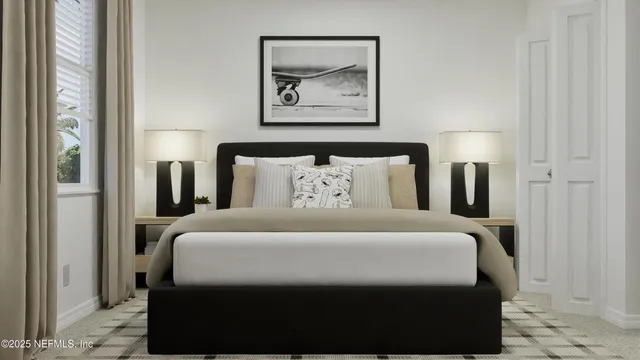 a bedroom with a bed and a lamp