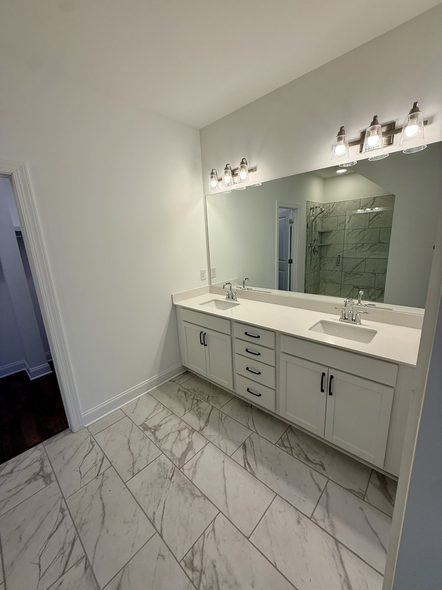 6421 Waymeet Dr Spring Hill Spring Hill, TN 37174 - Photo 11 of 29 a bathroom with a double vanity sink mirror and