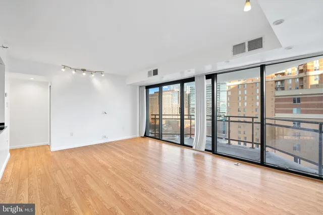 a view of an empty room with a window