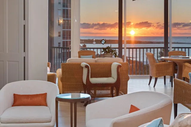 a kitchen with a white cabinets and window