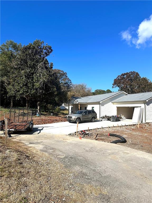 a view of a house with a yard and covered with snow