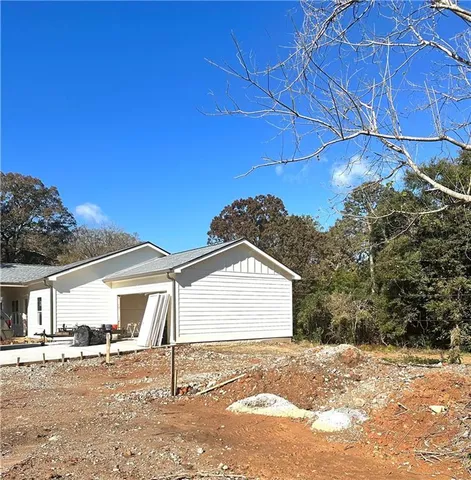a view of a backyard of the house