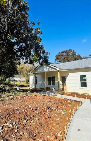 a view of a house with snow on the ground