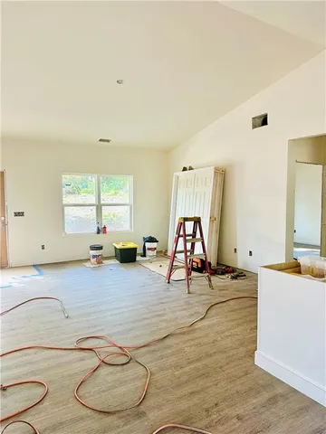 a room with gym equipment and a window