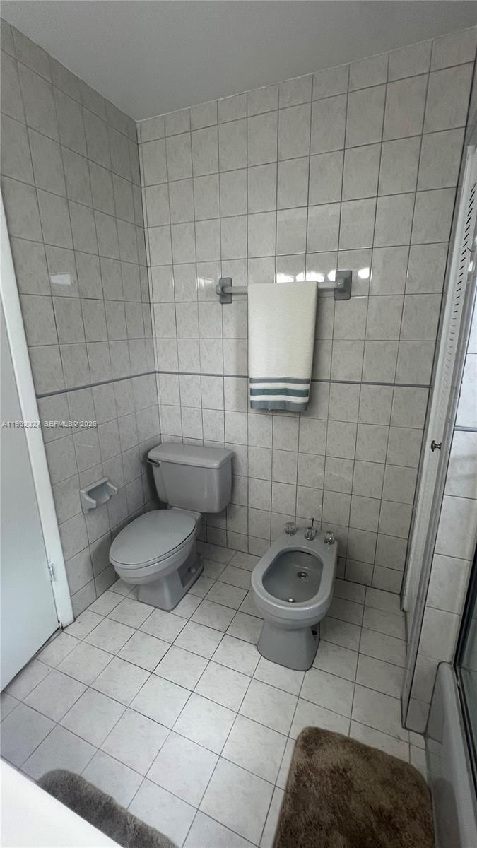 11920 Southwest 191st Terrace Miami, FL 33177 - Photo 5 of 10 a bathroom with a sink and a toilet