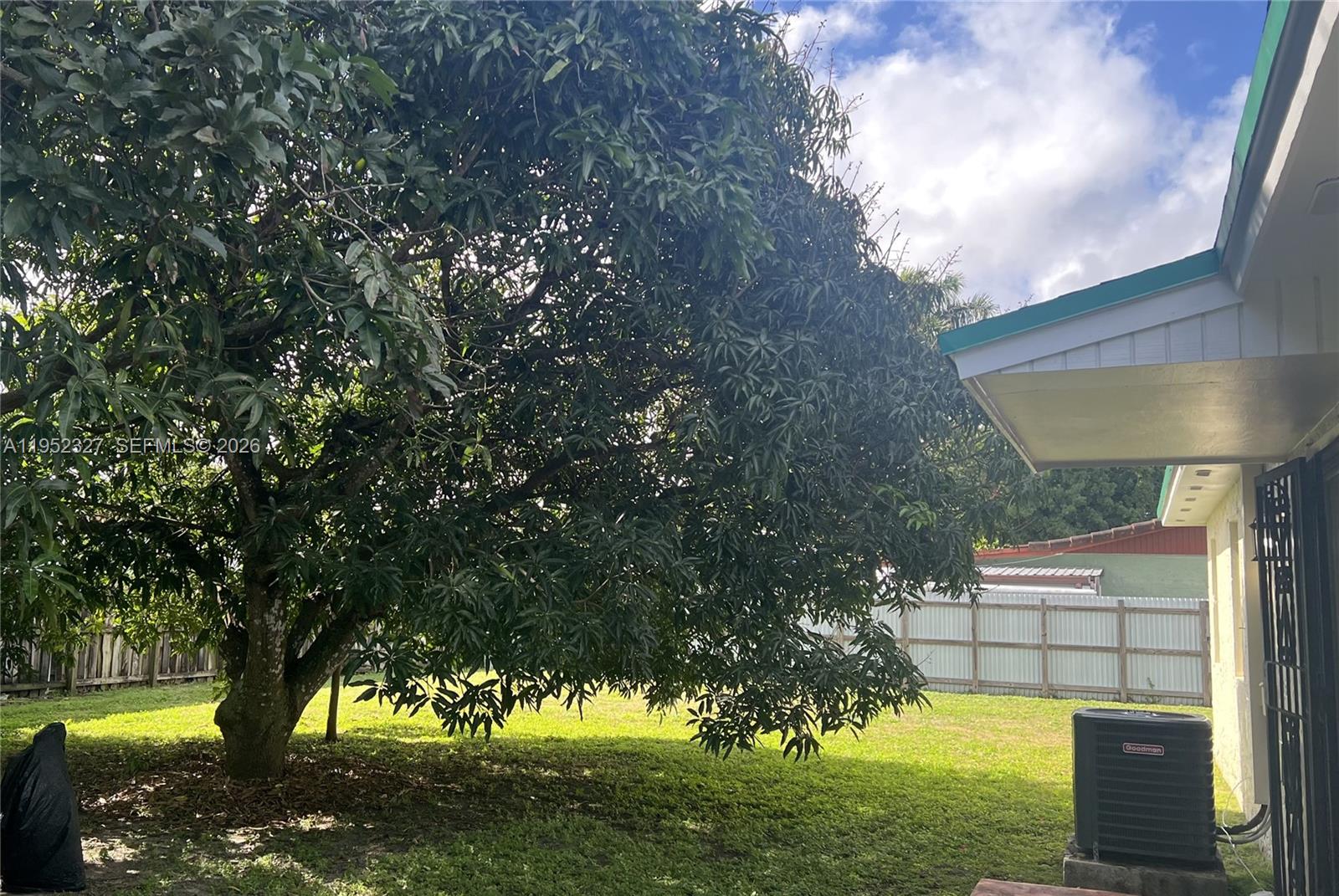 11920 Southwest 191st Terrace Miami, FL 33177 - Photo 8 of 10 a view of an outdoor space and a yard