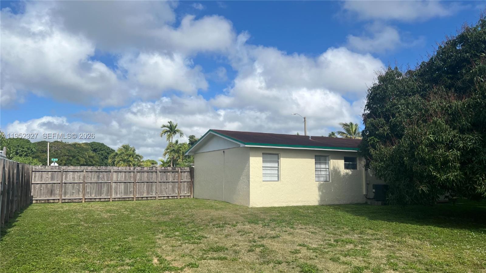 11920 Southwest 191st Terrace Miami, FL 33177 - Photo 10 of 10 a view of an house with backyard and garden