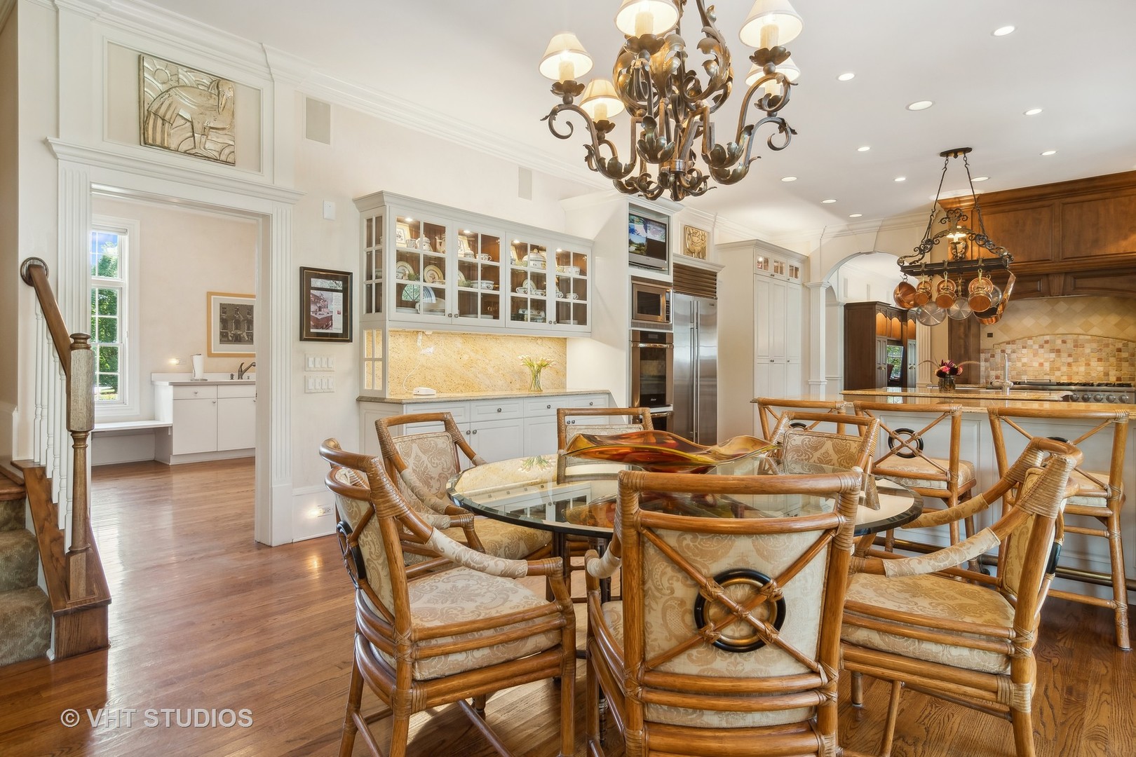 240 Donlea Road Barrington Hills, IL 60010 - Photo 15 of 63 a view of a dining room with furniture a chandelier and wooden floor