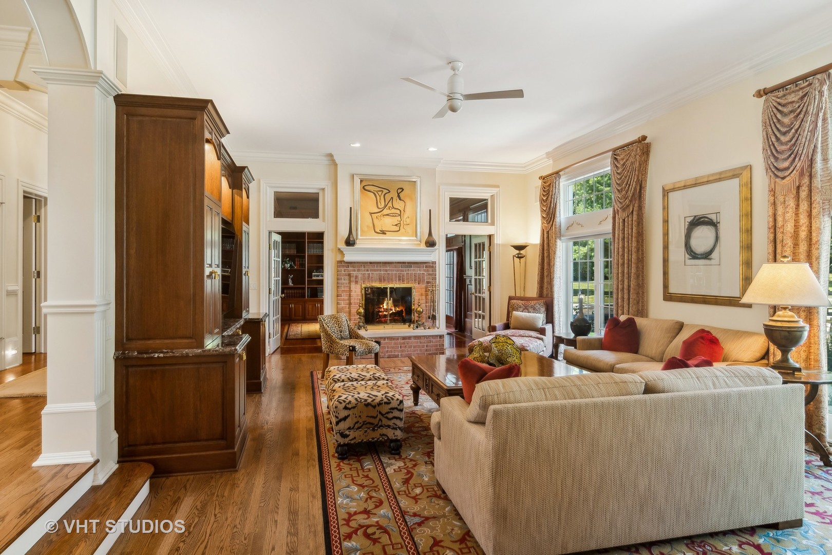 240 Donlea Road Barrington Hills, IL 60010 - Photo 23 of 63 a living room with furniture and a fireplace