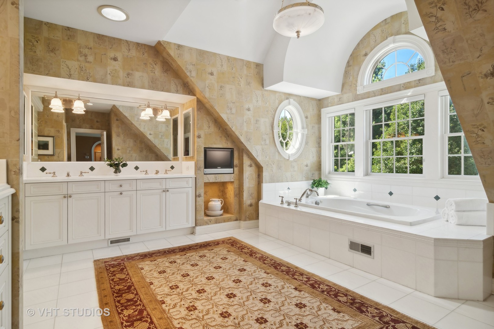 240 Donlea Road Barrington Hills, IL 60010 - Photo 29 of 63 a bathroom with a sink a vanity a mirror and a bathtub