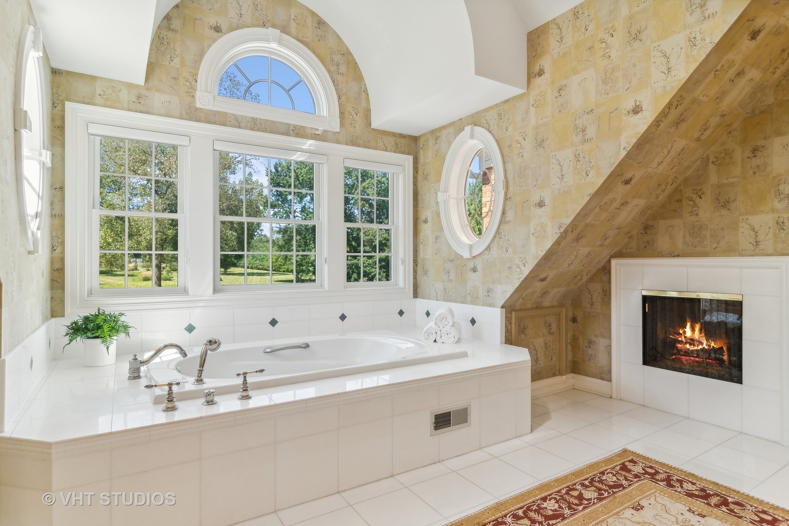 240 Donlea Road Barrington Hills, IL 60010 - Photo 30 of 63 a spacious bathroom with a bathtub a sink and a large window