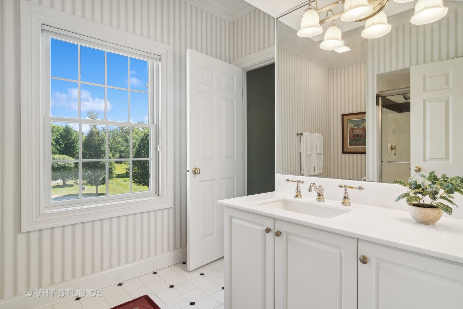 240 Donlea Road Barrington Hills, IL 60010 - Photo 38 of 63 a bathroom with a sink a vanity and a mirror