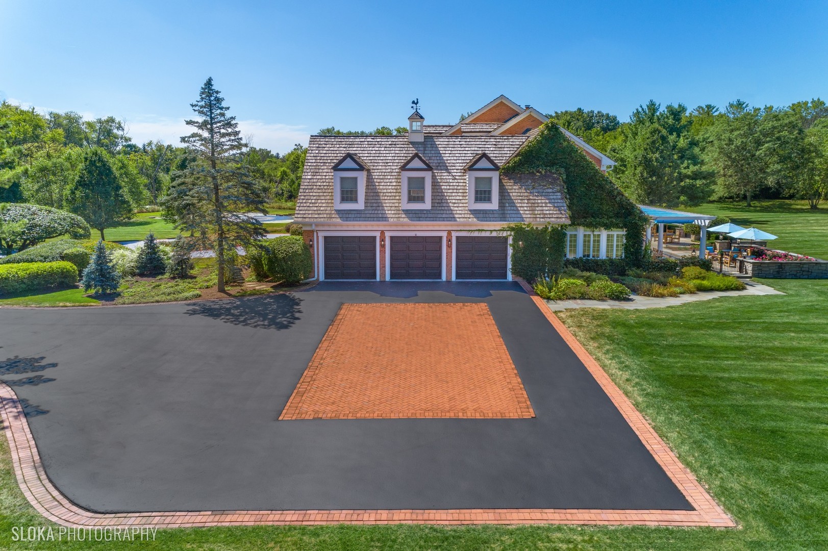 240 Donlea Road Barrington Hills, IL 60010 - Photo 50 of 63 a view of a house with a big yard and potted plants