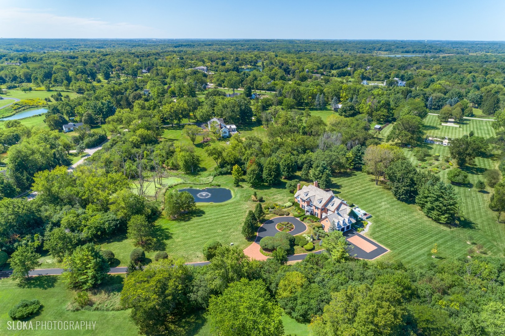 240 Donlea Road Barrington Hills, IL 60010 - Photo 59 of 63 an aerial view of a house with a yard